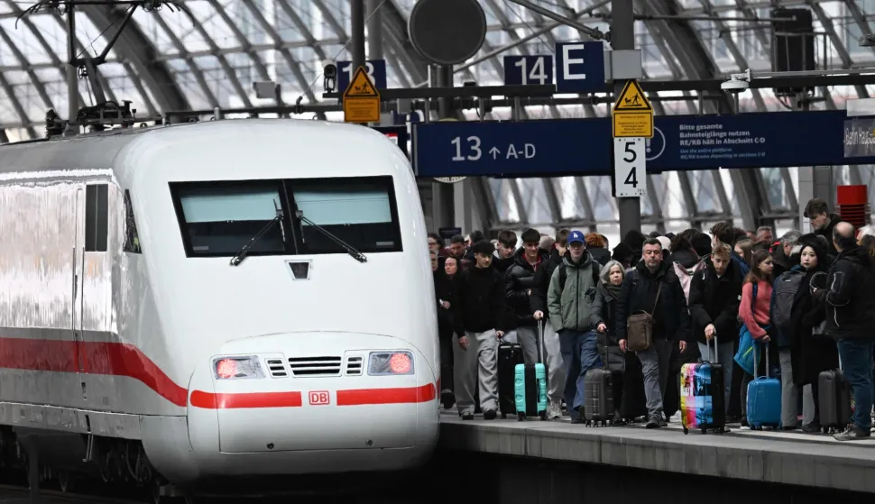 An ICE (Inter City Express) train by German railway operator Deutsche Bahn (DB) is pictured on March 27, 2026 at the main train station in Berlin. (Photo by RALF HIRSCHBERGER/AFP)