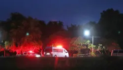 epa06873805 Ambulances transporting children to hospital after they have been rescue from Tham Luang cave, at a helicopter pad in Chiang Rai province, Thailand, 08 July 2018. Members of a children soccer team and their assistant coach who have been trapped in Tham Luang cave since 23 June 2018 have been rescued on 08 July 2018. EPA/RUNGROJ YONGRIT