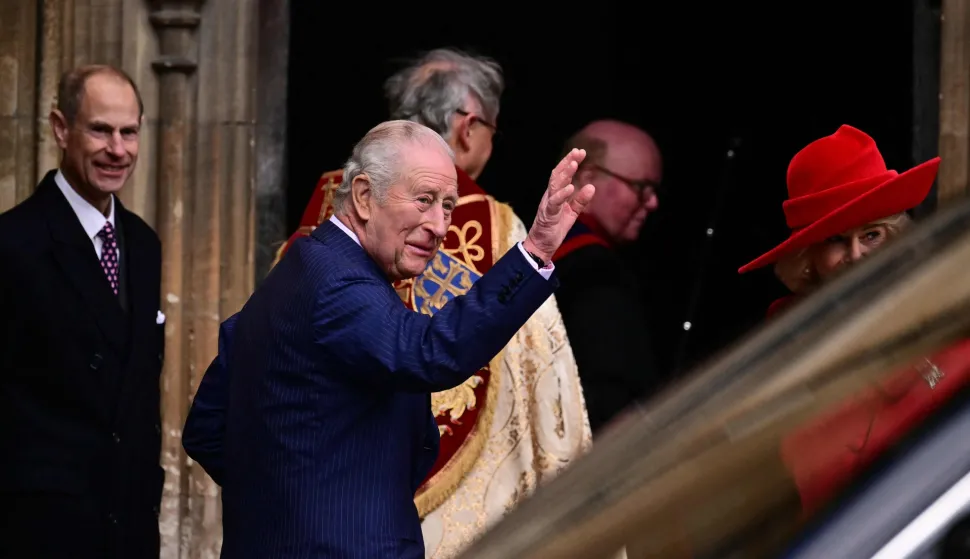 Britain's King Charles III waves as he arrives with members of his family at St George's Chapel, in Windsor, west of London, to attend the Easter Matins Service, on April 5, 2026. (Photo by Ben STANSALL/AFP)