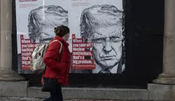 A woman walks past a wall poster in Washington, DC, on January 30, 2026, that warns of the impending expiration of the New START treaty. As the last remaining limit on U.S. and Russian nuclear weapons, the poster quotes President Trump, who has said it is ?not an agreement you want expiring.? (Photo by Probal Rashid/Sipa USA) Photo: Probal Rashid/SIPA USA
