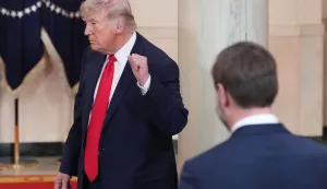 US Vice President JD Vance watches as US President Donald Trump gestures after speaking at a televised address on the conflict in the Middle East from the Cross Hall of the White House in Washington, DC on April 1, 2026. (Photo by Alex Brandon/POOL/AFP)