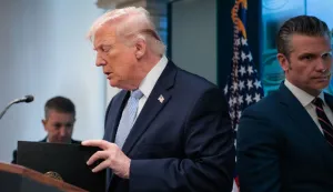 US President Donald Trump and Secretary of Defense Pete Hegseth (R) arrive to speak about the conflict in Iran in the James S. Brady Press Briefing Room of the White House on April 6, 2026, in Washington, DC. (Photo by Kent Nishimura/AFP)