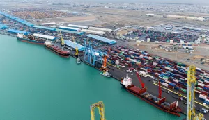 This aerial photo shows stacked shipping containers at Umm Qasr Port in Basra on March 12, 2026. Oil-rich Iraq has long been a proxy battleground between the United States and Iran, and saw itself dragged straight into the Middle East war after Israel and the US attacked Iran on February 28. (Photo by Hussein FALEH/AFP)