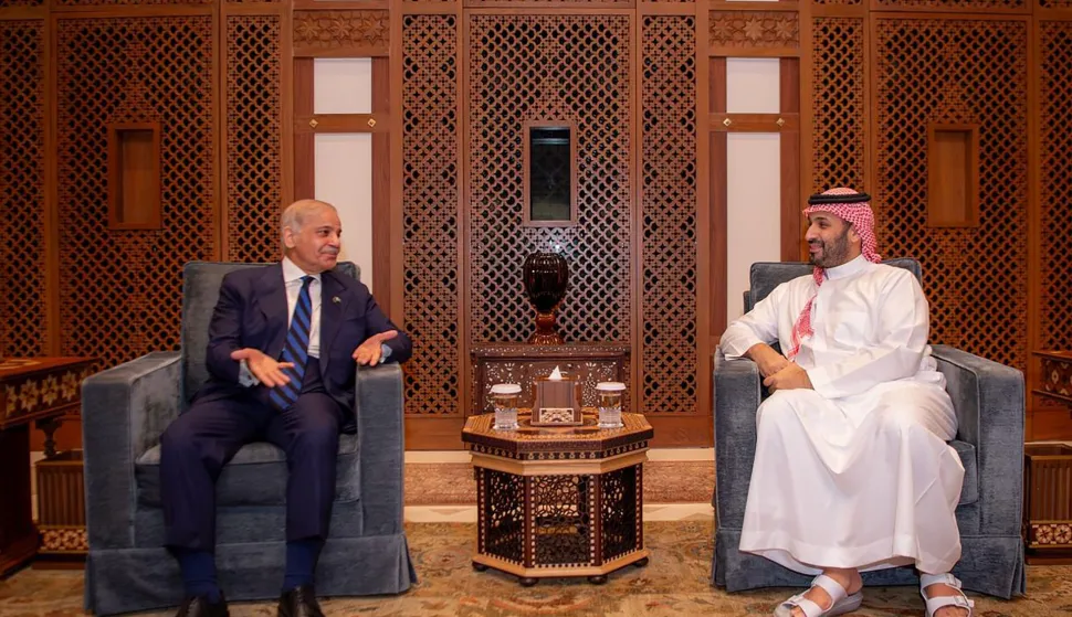 This handout photograph taken and released on March 12, 2026 by Pakistan's Prime Minister Office shows Saudi Crown Prince Mohammed bin Salman (R) meeting with Pakistan's Prime Minister Shehbaz Sharif (L) in Jeddah. (Photo by Handout/Pakistan Prime Minister Office/AFP)