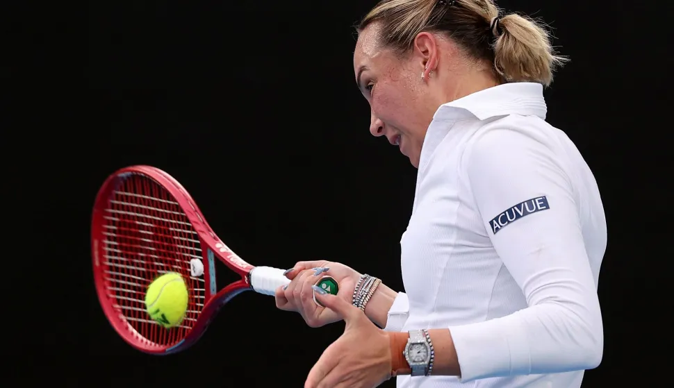 Croatia's Donna Vekic hits a return to Russia's Mirra Andreeva during their women's singles match on day two of the Australian Open tennis tournament in Melbourne on January 19, 2026. (Photo by Martin KEEP/AFP)/-- IMAGE RESTRICTED TO EDITORIAL USE - STRICTLY NO COMMERCIAL USE --