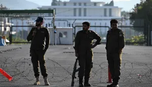Pakistani police officers stand guard near the President House in the Red Zone area in Islamabad on April 10, 2026. Pakistan has been preparing for high-stakes talks involving US and Iranian representatives over the war in the Middle East, with the White House saying Vice President JD Vance will be leading a team to the negotiations in Islamabad "this weekend". (Photo by Aamir QURESHI/AFP)