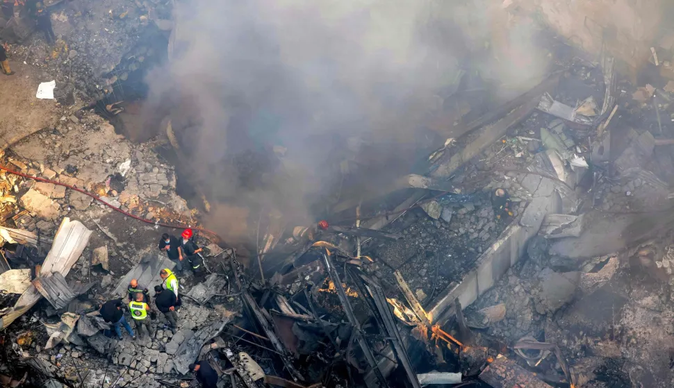 Firefighters attempt to extinguish a fire following an Israeli strike at the Corniche al-Mazraa neighbourhood of Beirut on April 8, 2026. Around 2:00 pm (1100 GMT), a series of Israeli strikes slammed into the Lebanese capital without warning, triggering scenes of panic. Israeli strikes on Lebanon on April 8, the heaviest since the war began in early March, left "dozens dead and hundreds wounded," according to a preliminary toll from the health ministry. (Photo by ibrahim AMRO/AFP)