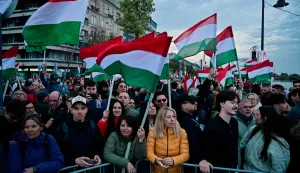 People hold Hungarian flags, as they await the results of the parliamentary election, in Budapest, Hungary, April 12, 2026. REUTERS/Marton Monus Photo: MARTON MONUS/REUTERS