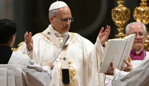 Pope Leo XIV presides over the Easter vigil as part of the Holy Week celebrations, at St Peter's basilica in the Vatican on April 4, 2026. (Photo by Andreas SOLARO/AFP)