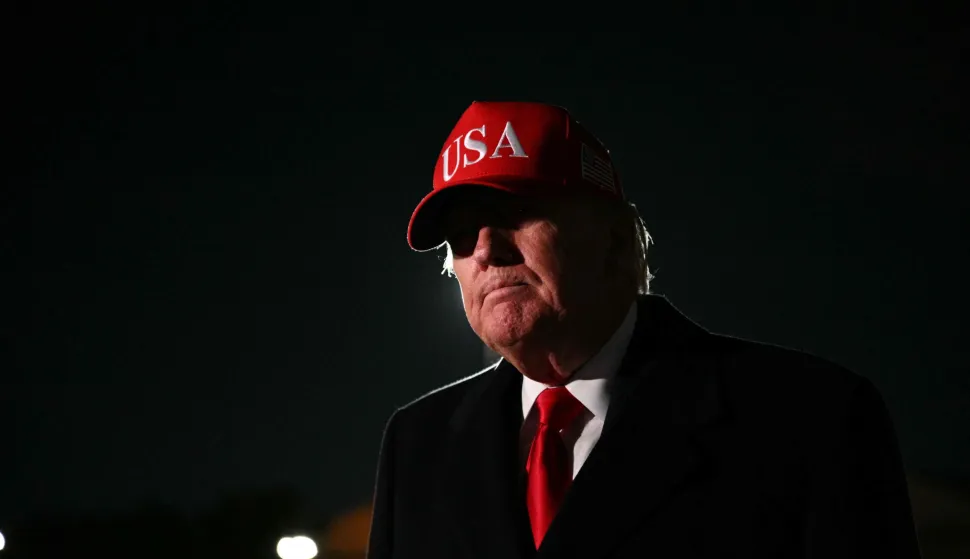 US President Donald Trump speaks to the press upon arrival at Joint Base Andrews in Maryland on April 12, 2026. Trump is returning to Washington, DC, after he attended a UFC event and spending the weekend at his Trump National Doral Miami resort. (Photo by Jim WATSON/AFP)