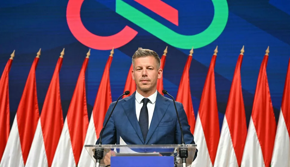 TOPSHOT - Peter Magyar, leader of the pro-European conservative TISZA party, delivers a press conference at the HUNGEXPO Congress and Exhibition Center in Budapest, Hungary, on April 13, 2026. The party of conservative Peter Magyar won a two-thirds parliamentary majority in Hungarian elections in a clear defeat for nationalist long-time Prime Minister Viktor Orban, according to near-complete results. (Photo by Attila KISBENEDEK/AFP)