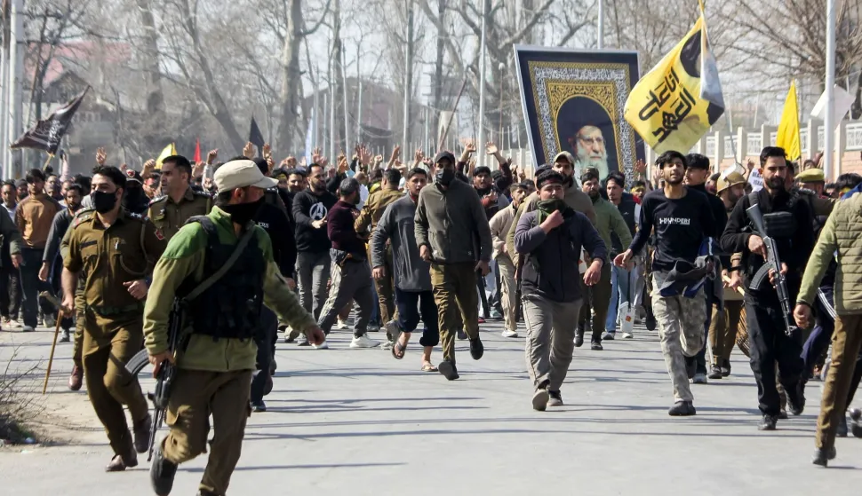 TOPSHOT - Shia Muslim demonstrators hold a portrait of Iran's late supreme leader Ayatollah Ali Khamenei in Srinagar on March 2, 2026 as restrictions were imposed amid protests over his death by US-Israel strikes. (Photo by Habib NAQASH/AFP)