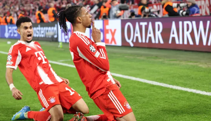 TOPSHOT - Bayern Munich's French midfielder #17 Michael Olise (R) celebrates scoring the 4-3 goal with his teammate Bayern Munich's Colombian forward #14 Luis Diaz during the UEFA Champions League quarter-final second leg football match between FC Bayern Munich and Real Madrid in Munich, southern Germany, on April 15, 2026. (Photo by Alexandra BEIER/AFP)