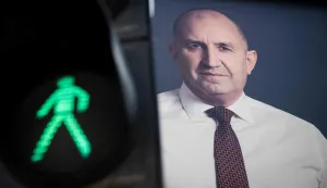 An electoral billboard of Progressive Bulgaria coalition leader and former president Rumen Radev is pictured next to a traffic light in Sofia on April 17, 2026. Bulgaria will hold its eighth general election in five years on April 19, 2026, with ex-president Rumen Radev's new grouping tipped to win a ballot many hope will end chronic instability. (Photo by Nikolay DOYCHINOV/AFP)