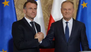 French President Emmanuel Macron (L) and Polish Prime Minister Donald Tusk shake hands at the end of a joint press conference at the Main Town Hall in Gdansk, Poland, on April 20, 2026 during the French President's one-day visit to Poland. (Photo by Ludovic MARIN/AFP)
