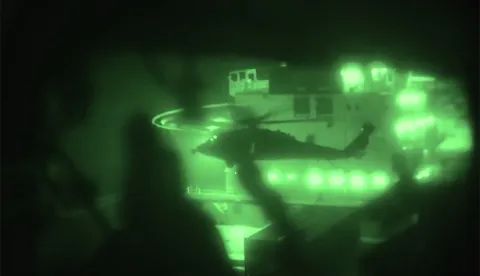 TOPSHOT - This screen grab obtained from a video released by the US Central Command on their X account on April 20, 2026, shows US Marines boarding and seizing the Iranian-flagged vessel M/V Touska after departing by helicopter from amphibious assault ship USS Tripoli in the Arabian sea on April 19, 2026. A US destroyer on April 19 fired on and seized an Iranian-flagged cargo ship in the Gulf of Oman that tried to evade a US naval blockade, the US president and the US military said. (Photo by US Central Command Public Affairs/AFP)/RESTRICTED TO EDITORIAL USE - MANDATORY CREDIT "AFP PHOTO/US CENTRAL COMMAND PUBLIC AFFAIRS" - HANDOUT - NO MARKETING NO ADVERTISING CAMPAIGNS - DISTRIBUTED AS A SERVICE TO CLIENTS