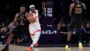LOS ANGELES, CALIFORNIA - APRIL 21: Aaron Holiday #0 of the Houston Rockets blocks the pass to Bronny James #9 of the Los Angeles Lakers during the first half of Game Two of the NBA Western Conference First Round Playoffs at Crypto.com Arena on April 21, 2026 in Los Angeles, California. NOTE TO USER: User expressly acknowledges and agrees that, by downloading and or using this photograph, User is consenting to the terms and conditions of the Getty Images License Agreement. Ronald Martinez/Getty Images/AFP (Photo by RONALD MARTINEZ/GETTY IMAGES NORTH AMERICA/Getty Images via AFP)