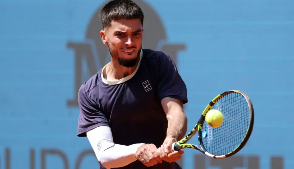 Croatia?s Dino Prizmic returns the ball to US Ben Shelton during their 2026 ATP Tour Madrid Open tennis tournament second round singles match at the Caja Magica in Madrid, on April 24, 2026. (Photo by Thomas COEX/AFP)
