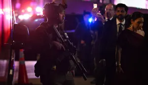 TOPSHOT - Armed commandos stand by as special guests are evacuated from the back of the Washington Hilton after shots were reportedly fired during the White House Correspondents' dinner at the Washington Hilton in Washington, DC, on April 25, 2026. Shots were allegedly fired as US President Donald Trump attended a press dinner in Washington on Saturday night, witnesses and AFP reporters said as loud bangs were heard at the hotel venue. (Photo by ROBERTO SCHMIDT/AFP)