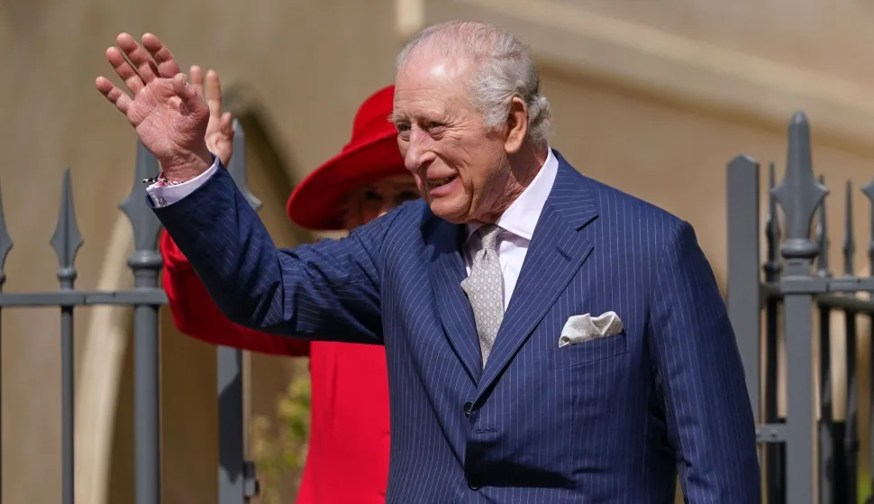 Britain's King Charles III and Britain's Queen Camilla leave St George's Chapel, in Windsor, west of London, after attending the Easter Matins Service, on April 5, 2026. (Photo by Alberto Pezzali/POOL/AFP)