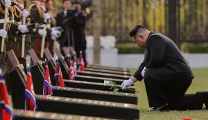 This picture taken on April 26, 2026 and released by North Korea's official Korean Central News Agency (KCNA) via KNS on April 27, 2026 shows North Korean leader Kim Jong Un (R) laying a flower at the tombstones of North Korean troops during the inauguration ceremony of the Memorial Museum of Combat Feats at the Overseas Military Operations in Pyongyang. (Photo by KCNA VIA KNS/AFP)/South Korea OUT/---EDITORS NOTE--- RESTRICTED TO EDITORIAL USE - MANDATORY CREDIT "AFP PHOTO/KCNA VIA KNS" - NO MARKETING NO ADVERTISING CAMPAIGNS - DISTRIBUTED AS A SERVICE TO CLIENTSTHIS PICTURE WAS MADE AVAILABLE BY A THIRD PARTY. AFP CAN NOT INDEPENDENTLY VERIFY THE AUTHENTICITY, LOCATION, DATE AND CONTENT OF THIS IMAGE./