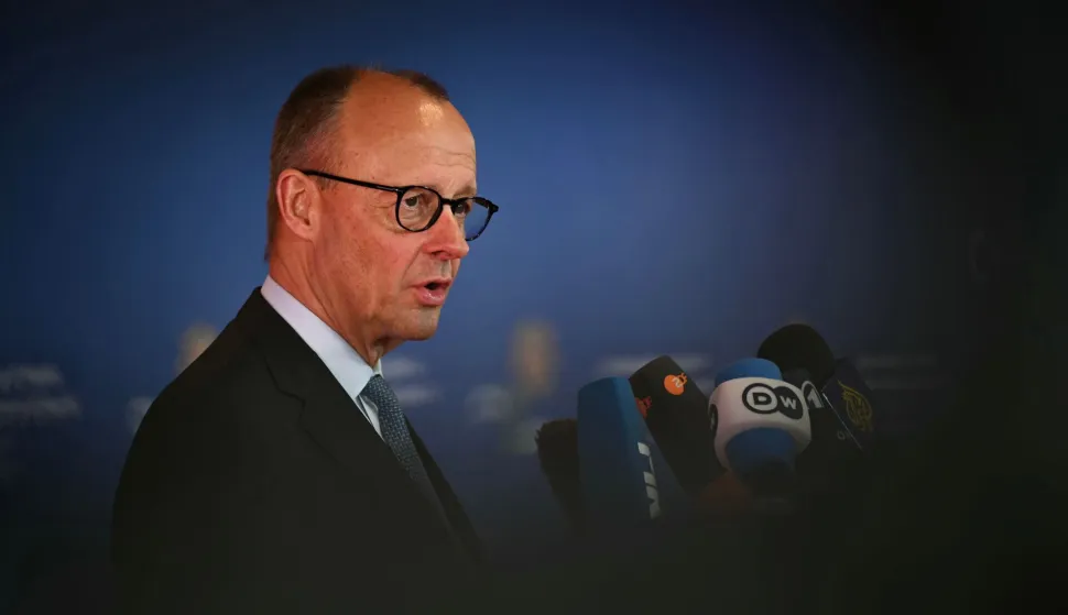 Germany's Chancellor Friedrich Merz speaks to journalists as he arrives for an informal meeting of the European Council in Nicosia on April 24, 2026. (Photo by NICOLAS TUCAT/AFP)