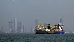 TOPSHOT - Commercial vessels are pictured offshore in Dubai on March 11, 2026. New attacks hit three commercial ships in the Gulf on March 11, with one of the vessels in flames as Iran pressed its campaign against its oil-exporting neighbours, threatening shipping in the Strait of Hormuz and plunging the global energy economy into crisis. (Photo by AFP)/Attention editors: AFP covers the war in the Middle East through its extensive regional network, including bureaus in Tehran, Jerusalem and several neighboring countries.Since the start of the conflict, journalists have been working under increasingly restrictive conditions. Authorities in several countries have limited reporters? movements, photo and live video coverage from sensitive locations. Some governments and armed groups have banned images of missile or drone strikes and other security-related sites./