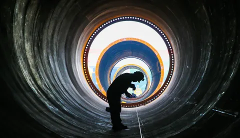 A worker is producing wind turbine towers in a workshop of a wind power equipment enterprise in Lianyungang Economic and Technological Development Zone, Jiangsu Province, China on October 9, 2025. (Photo by CFoto/Sipa USA) Photo: Costfoto/SIPA USA