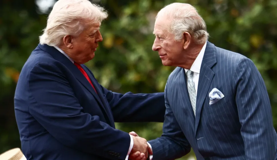 TOPSHOT - US President Donald Trump and Britain's King Charles III shake hands during an arrival ceremony on the South Lawn of the White House in Washington, DC, on April 28, 2026. (Photo by Henry NICHOLLS/AFP)