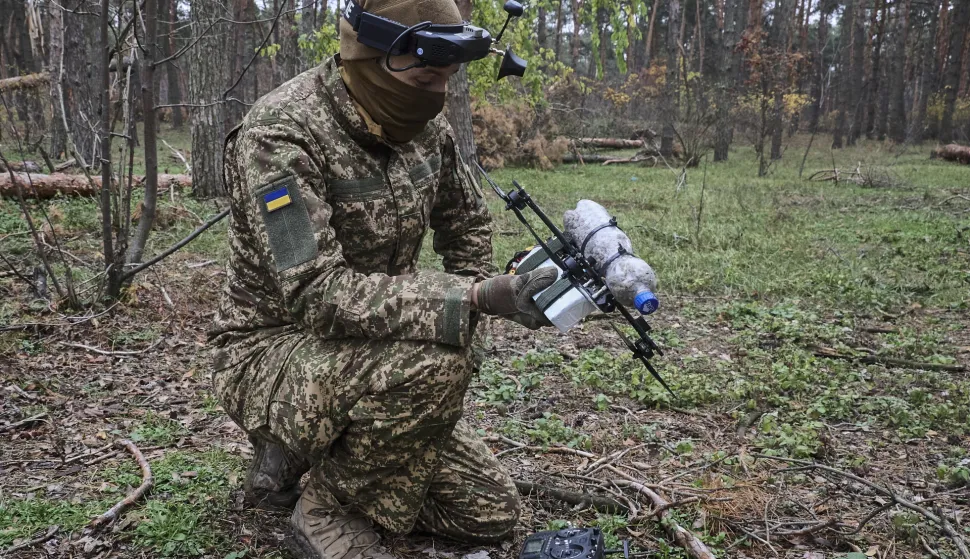 epa12505452 Servicemen of a special unit of the 13th brigade of the National Guard of Ukraine 'Khartiya' conducting training with FPV drones in conditions close to real combat, in an undisclosed location in the Kharkiv region, Ukraine, 05 November 2025, amid the ongoing Russian invasion. Russian troops entered Ukrainian territory on 24 February 2022, starting a conflict that has provoked destruction and a humanitarian crisis. EPA/SERGEY KOZLOV