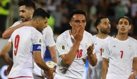 (FILES) Iran's midfielder #18 Amirhossein Hosseinzadeh celebrates scoring his team's third goal during the FIFA World Cup 2026 Asia zone qualifiers group A football match between Iran and the North Korea at the Azadi Sports Complex in Tehran on June 10, 2025. After days of strikes on sites all over Iran, and Tehran's military lashing out at US targets and allies in the Gulf, Iran's participation in the 2026 World Cup is in serious doubt. (Photo by ATTA KENARE/AFP)