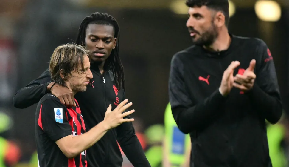 AC Milan's Croatian midfielder #14 Luka Modric (L) and AC Milan's Portuguese forward #10 Rafael Leao leave the pitch at the end of the Italian Serie A football match between AC Milan and Juventus FC at the San Siro stadium in Milan, northern Italy, on April 26, 2026. (Photo by Stefano RELLANDINI/AFP)