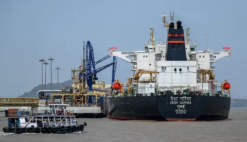 Desh Garima, an Indian-flagged tanker carrying crude oil that transited through the Strait of Hormuz, is seen docked at an offloading terminal along the coast in Mumbai on April 30, 2026. India, the world's third-largest oil buyer, normally sources about half of its crude through the Strait of Hormuz, a vital waterway that has seen only a trickle of traffic since the United States and Israel launched attacks on Iran on February 28. (Photo by Punit PARANJPE/AFP)