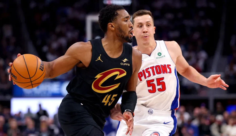 DETROIT, MICHIGAN - MAY 05: Donovan Mitchell #45 of the Cleveland Cavaliers drives around Duncan Robinson #55 of the Detroit Pistons during the second half in Game One of the Second Round of the NBA Eastern Conference Playoffs at Little Caesars Arena on May 05, 2026 in Detroit, Michigan. NOTE TO USER: User expressly acknowledges and agrees that, by downloading and or using this photograph, User is consenting to the terms and conditions of the Getty Images License Agreement. Gregory Shamus/Getty Images/AFP (Photo by Gregory Shamus/GETTY IMAGES NORTH AMERICA/Getty Images via AFP)