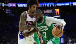 PHILADELPHIA, PENNSYLVANIA - APRIL 30: Jaylen Brown #7 of the Boston Celtics drives around Kelly Oubre Jr. #9 of the Philadelphia 76ers during the third quarter in Game Six of the First Round of the NBA Eastern Conference Playoffs at Xfinity Mobile Arena on April 30, 2026 in Philadelphia, Pennsylvania. NOTE TO USER: User expressly acknowledges and agrees that, by downloading and or using this photograph, User is consenting to the terms and conditions of the Getty Images License Agreement. Elsa/Getty Images/AFP (Photo by ELSA/GETTY IMAGES NORTH AMERICA/Getty Images via AFP)