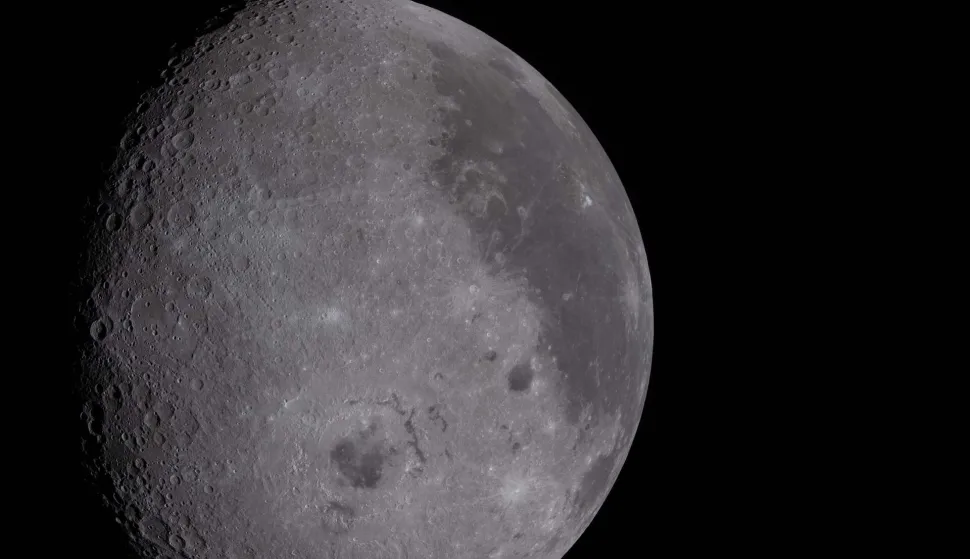 This handout picture released on April 8, 2026, by NASA shows a view of the Moon, including the Orientale basin and the dark lava plains visible, as seen from the Orion spacecraft on April 6, 2026. The Artemis II astronauts wrapped up their lunar flyby as they continue their journey back to Earth on Tuesday, bringing with them rich celestial observations including little-known lunar craters, a solar eclipse and meteor strikes that scientists hope will open doors. (Photo by Handout/NASA/AFP)/RESTRICTED TO EDITORIAL USE - MANDATORY CREDIT "AFP PHOTO/NASA" - HANDOUT - NO MARKETING NO ADVERTISING CAMPAIGNS - DISTRIBUTED AS A SERVICE TO CLIENTS