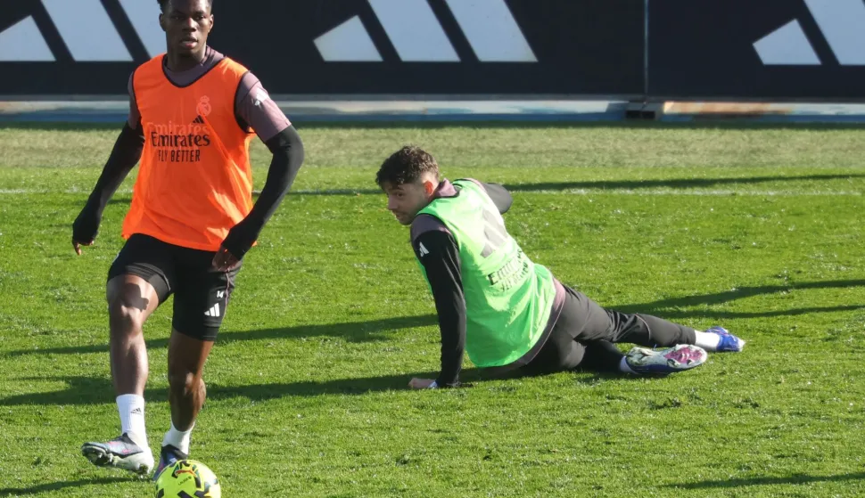 (FILES) Real Madrid's French midfielder #14 Aurelien Tchouameni (L) and Real Madrid's Uruguayan midfielder #08 Federico Valverde take part in a training session at Real Madrid Sports City in Valdebebas, in the outskirts of Madrid, on December 30, 2025. Real Madrid announced on May 8, 2026 the opening of disciplinary proceedings to two of its players, the Uruguayan Fede Valverde and the French Aurelien Tchouameni, who would have been involved in a violent altercation that sent the first one to the hospital for a small bleeding wound. (Photo by Pierre-Philippe MARCOU/AFP)
