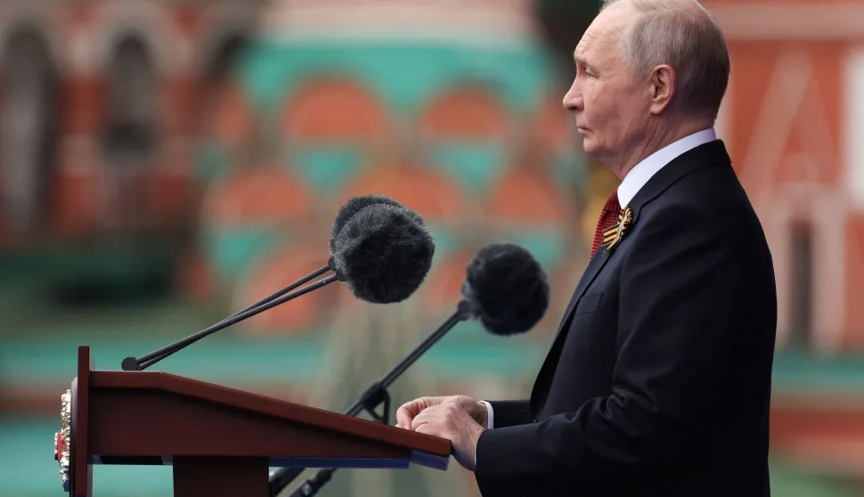 In this pool photograph distributed by the Russian state agency Sputnik, Russia's President Vladimir Putin gives a speech during the Victory Day military parade at Red Square in Moscow on May 9, 2026. Russia celebrates the 81st anniversary of the Soviet Union's victory over Nazi Germany in World War Two (WWII). (Photo by Vyacheslav PROKOFYEV/POOL/AFP)