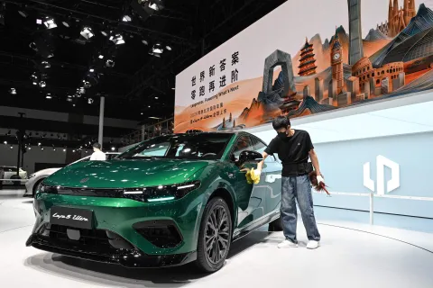 A Leapmotor Lafa5 Ultra is seen on display on the opening day of the Beijing Auto Show in Beijing on April 24, 2026. Thousands squeezed into the world's biggest car show on April 24, snapping selfies beside Chinese electric vehicles as automakers showcased AI, humanoid robots and flying-car ambitions in a cut-throat market. (Photo by Jade GAO/AFP)