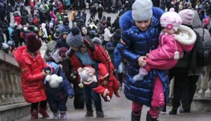 epa09806463 Women and children as displaced Ukrainians arrive at the Lviv train station in western Ukraine, as they try to leave Ukraine amid Russian military operation in the country, in Lviv, Ukraine, 06 March 2022. Russian troops began a military operation in Ukraine on 24 February leading to a massive exodus of Ukrainians to neighboring countries as well as internal displacements. EPA/MIGUEL A. LOPES
