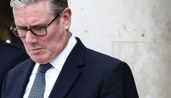 (FILES) Britain's Prime Minister Keir Starmer reacts as he prepares to leave the Elysee Presidential Palace in Paris on April 17, 2026. British Prime Minister Keir Starmer promised on May 9, 2026, he would "listen to voters" after his Labour party received a historic drubbing in local and regional elections. (Photo by Tom Nicholson/POOL/AFP)