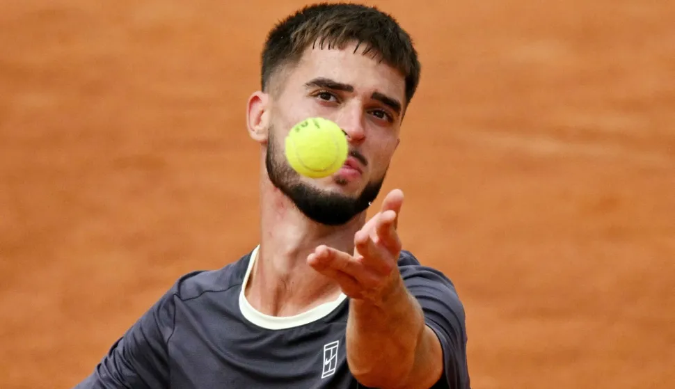 Croatia's Dino Prizmic serves to Russia's Karen Khachanov during the ATP Rome Open tennis tournament at Foro Italico in Rome on May 12, 2026. (Photo by Andreas SOLARO/AFP)