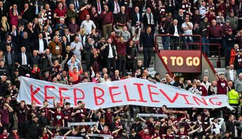 Hearts fans react after the final whistle in the Scottish Premiership football match between Hearts and Rangers at Tynecastle Stadium in Edinburgh on May 4, 2026. Hearts are hoping to become the first club other than Celtic and Rangers to win the Scottish crown since Aberdeen in 1985. (Photo by ANDY BUCHANAN/AFP)