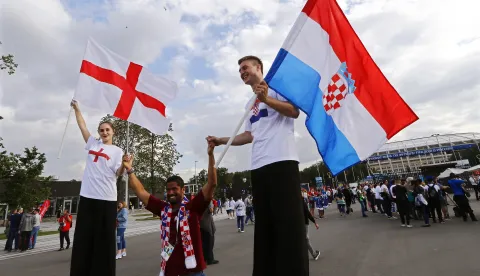 epa06880869 Supporters of England (L) and Croatia (R) arrive for the FIFA World Cup 2018 semi final soccer match between Croatia and England in Moscow, Russia, 11 July 2018. EPA/ABEDIN TAHERKENAREH