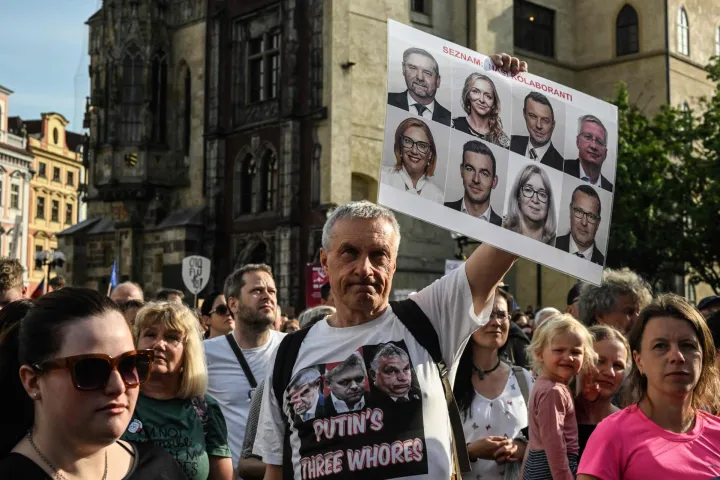 A man with a placard which reads "List of our collaborators" as several hundred people gather for a protest march to express support for public service media on May 5, 2026, in Prague, Czech Republic. (Photo by Michal Cizek/AFP)