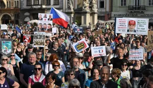 Several hundred people holding placards gather for a protest march to express support for public service media on April 22, 2026, in Prague, Czech Republic. Placard reads "Czech prime Minister Andrej Babis wants to control the media" (Photo by Michal Cizek/AFP)