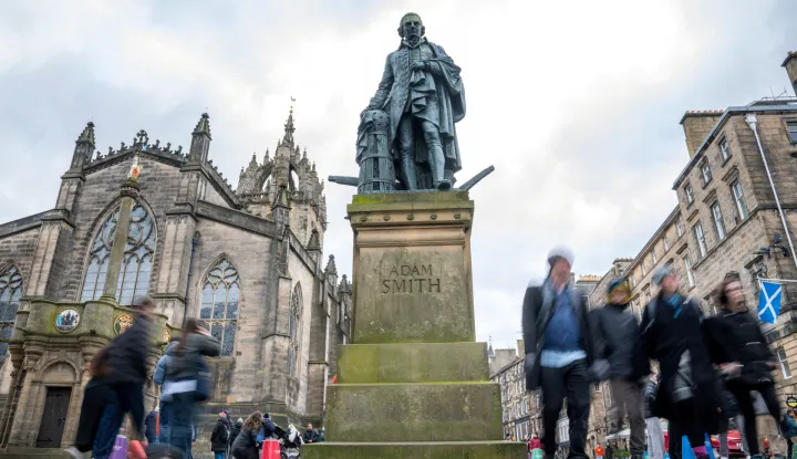 The bronze statue of Adam Smith, the renowned economist and philosopher, located on the Royal Mile, positioned just outside St Giles' Cathedral in Edinburgh, Scotland, Britain February 18, 2026. REUTERS/Lesley Martin Photo: Lesley Martin/REUTERS