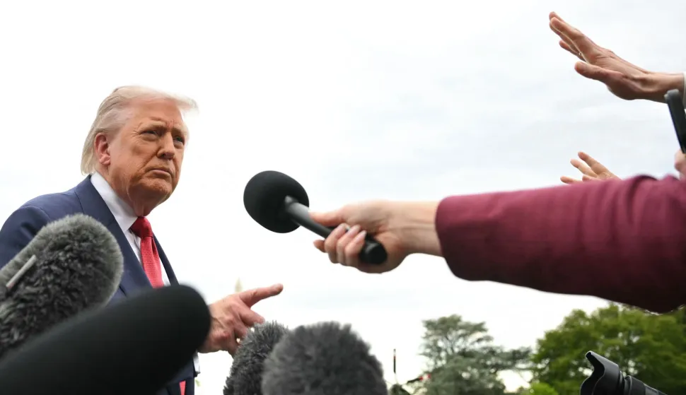 US President Donald Trump speaks to journalists as he makes his way to board Marine One before departing from the South Lawn of the White House in Washington, DC on May 8, 2026. Trump is traveling to Sterling, Virginia, where he will participate in a LIV Golf dinner. (Photo by Mandel NGAN/AFP)