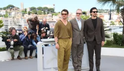 Miles Teller, James Gray and Adam Driver pose at the photocall of 'Paper Tiger' during the 79th Cannes Film Festival at Palais des Festivals in Cannes, France, on 17 May 2026.