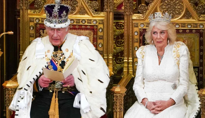 Britain's King Charles III, wearing the Imperial State Crown and the Robe of State, reads the King's Speech in the House of Lords chamber, during the State Opening of Parliament, at the Houses of Parliament, in London on May 13, 2026. (Photo by Arthur Edwards/POOL/AFP)